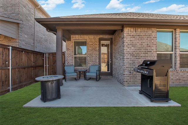 view of patio / terrace featuring central AC unit, fence, and area for grilling