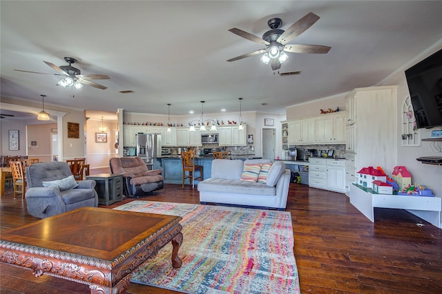 living area featuring dark wood-style floors, ceiling fan, and visible vents