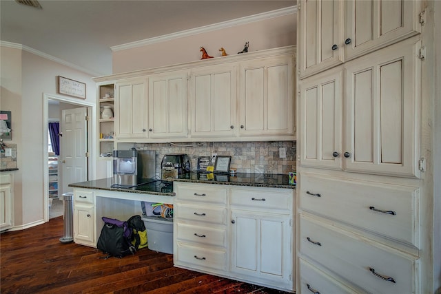 kitchen featuring open shelves, ornamental molding, dark wood-style flooring, and dark stone countertops