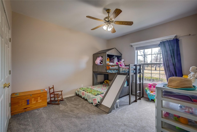 bedroom with carpet floors, ceiling fan, and baseboards