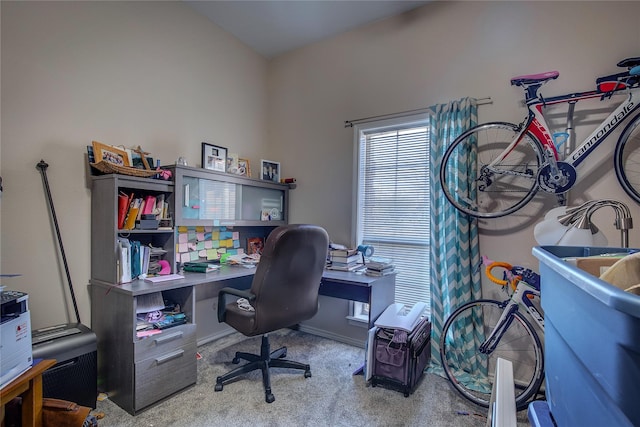 office featuring baseboards and light colored carpet