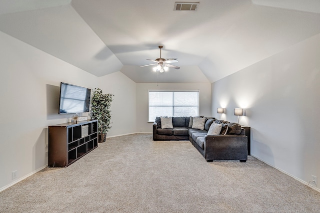 living area with visible vents, a ceiling fan, light carpet, vaulted ceiling, and baseboards