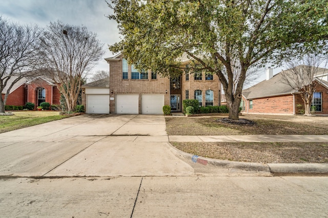 view of front of home with brick siding, driveway, and an attached garage