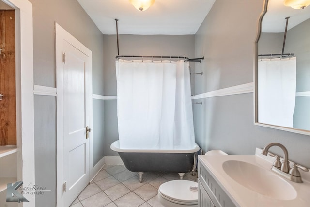 full bathroom with vanity, toilet, and tile patterned floors