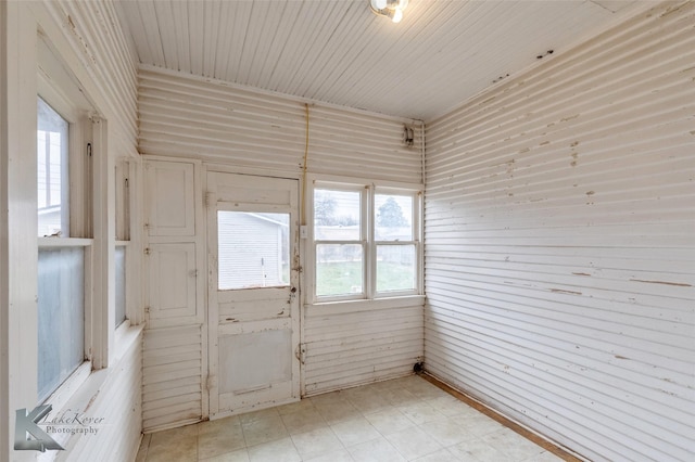 unfurnished sunroom with wood ceiling