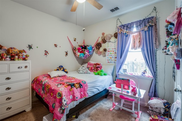 bedroom featuring carpet, visible vents, and a ceiling fan