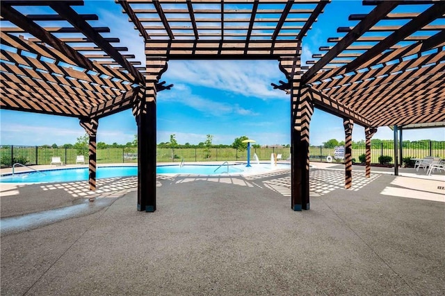 pool with a fenced backyard, a patio, and a pergola