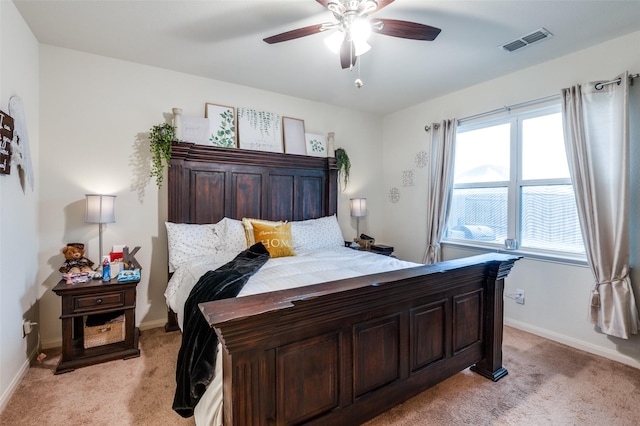 bedroom with visible vents, ceiling fan, light carpet, and baseboards