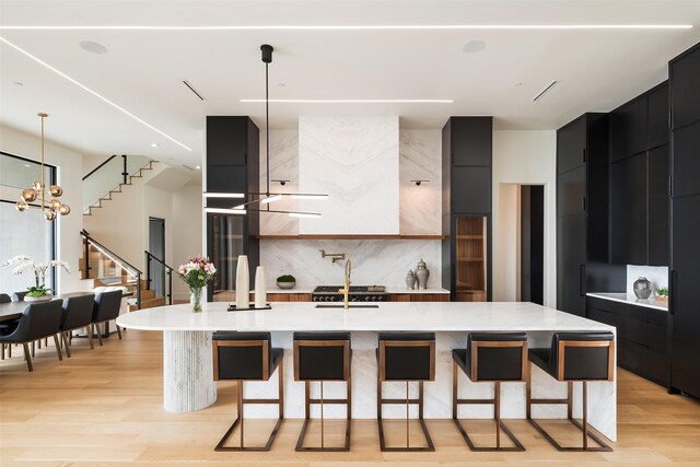 kitchen featuring a spacious island, modern cabinets, and pendant lighting