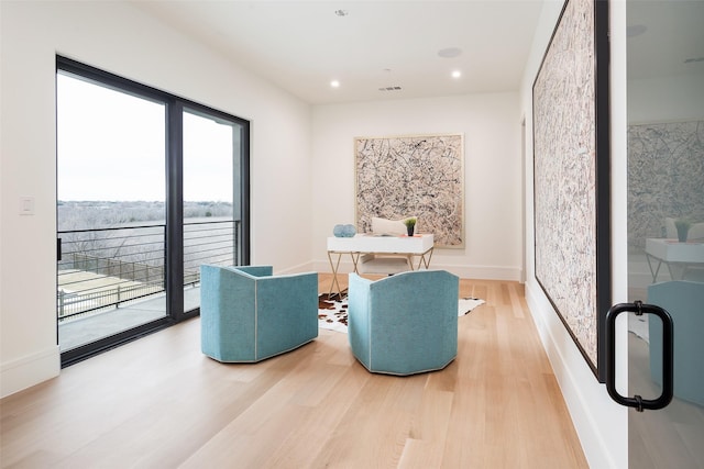 sitting room with visible vents, recessed lighting, light wood-style flooring, and baseboards