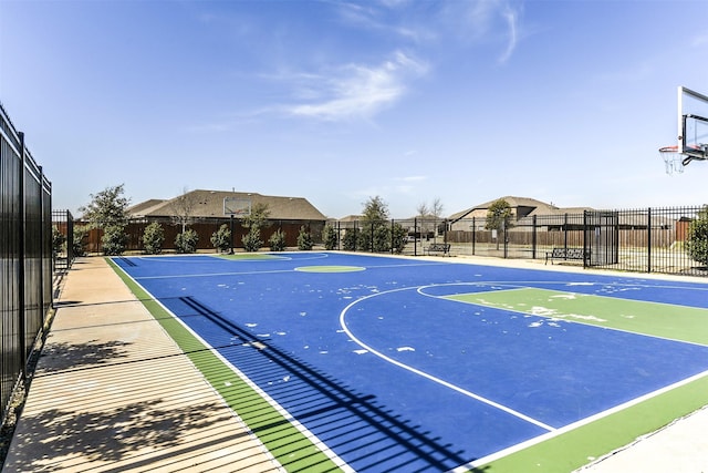 view of sport court featuring community basketball court and fence