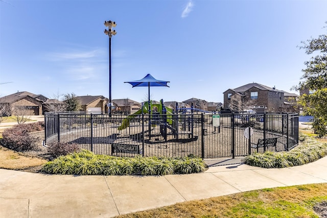 surrounding community with a residential view and fence