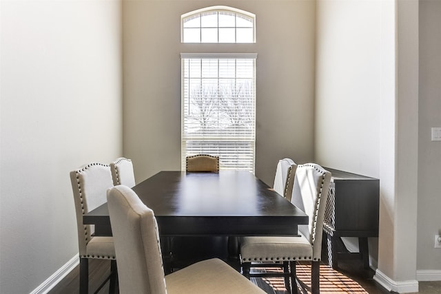 dining space featuring baseboards