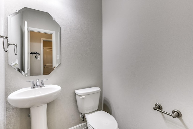 bathroom featuring a sink and toilet