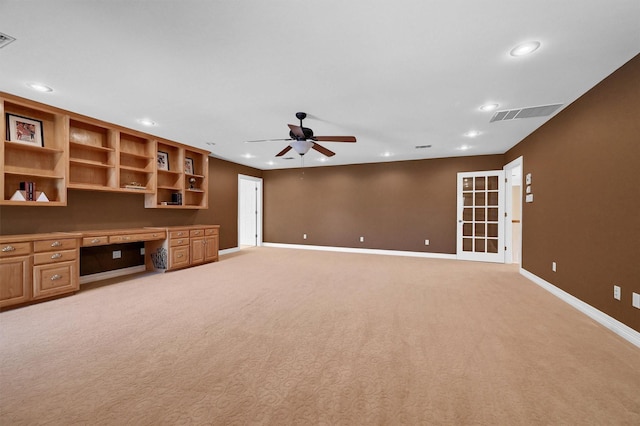 unfurnished living room featuring recessed lighting, visible vents, baseboards, a ceiling fan, and built in desk