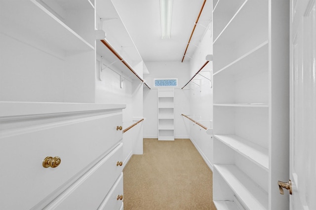 walk in closet with light carpet and visible vents