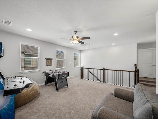 rec room featuring light colored carpet, visible vents, baseboards, and recessed lighting