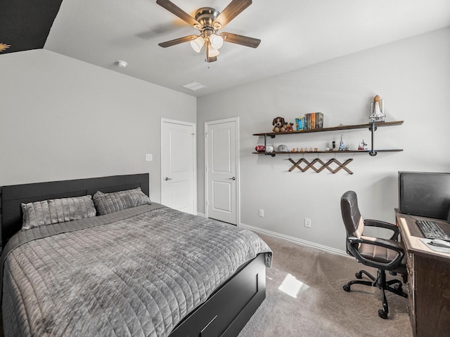 bedroom with carpet floors, ceiling fan, baseboards, and lofted ceiling