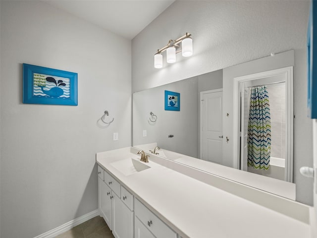 full bathroom featuring shower / bathtub combination with curtain, vanity, baseboards, and tile patterned floors