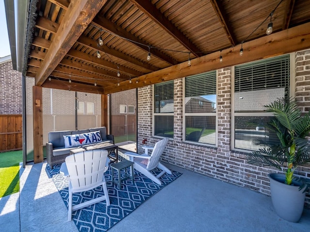 view of patio with fence and an outdoor living space