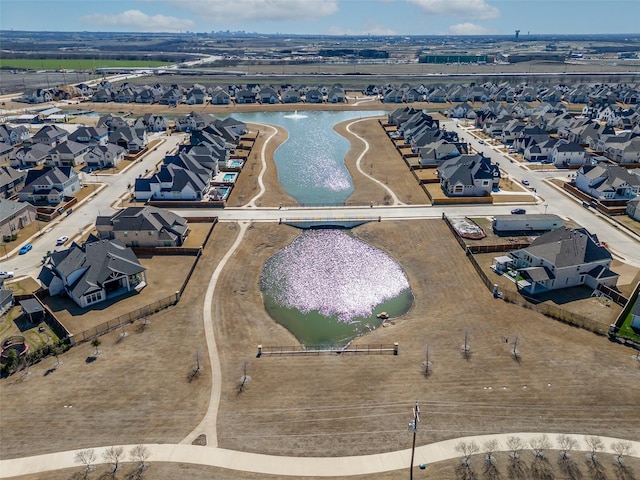 bird's eye view with a water view and a residential view