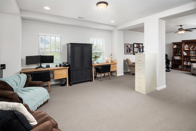 office with a healthy amount of sunlight, carpet, and visible vents