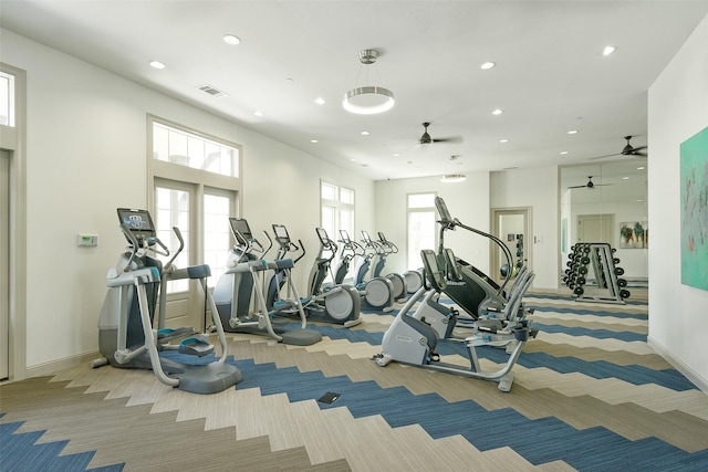 workout area with recessed lighting, light colored carpet, visible vents, and baseboards