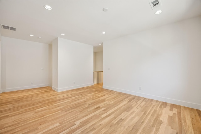 spare room featuring recessed lighting, visible vents, and light wood-style flooring