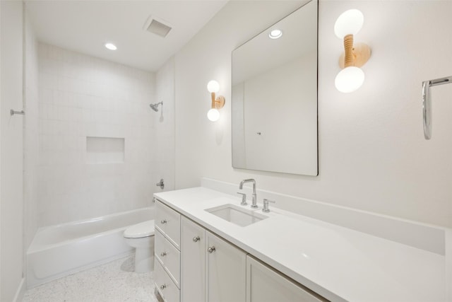 full bath with visible vents, toilet, tub / shower combination, vanity, and speckled floor