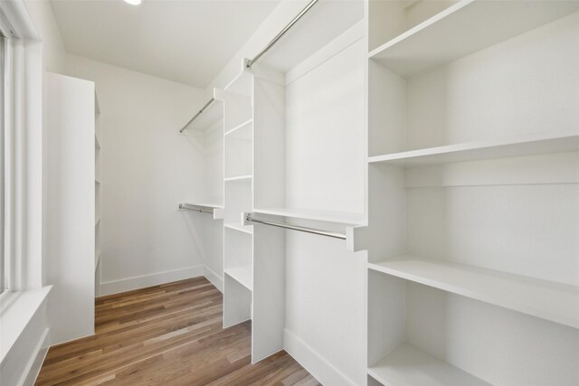 spacious closet with wood finished floors