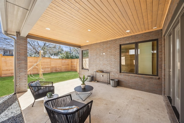 view of patio / terrace with a fenced backyard and an outdoor living space