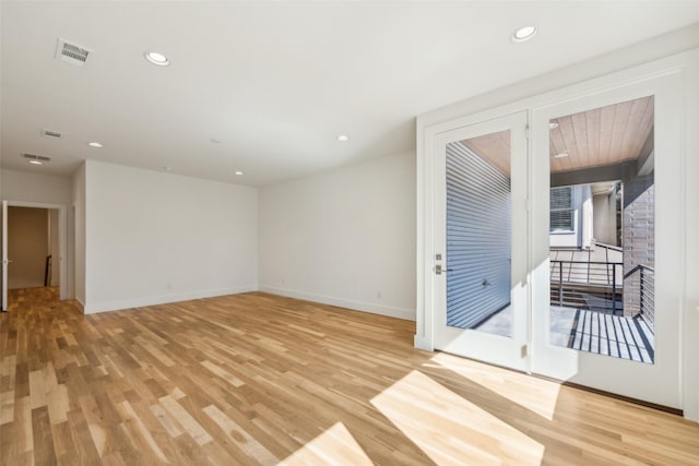 spare room featuring recessed lighting, baseboards, visible vents, and light wood finished floors