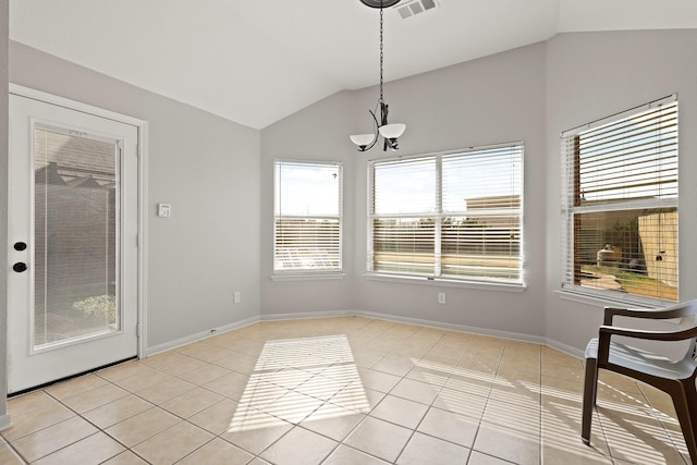 unfurnished dining area featuring lofted ceiling, light tile patterned floors, baseboards, and visible vents