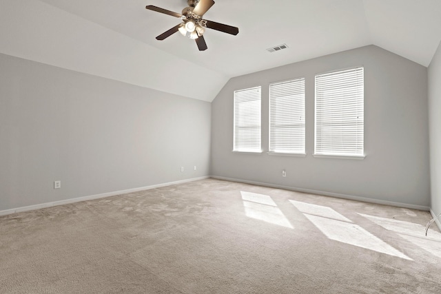 bonus room featuring lofted ceiling, visible vents, and baseboards