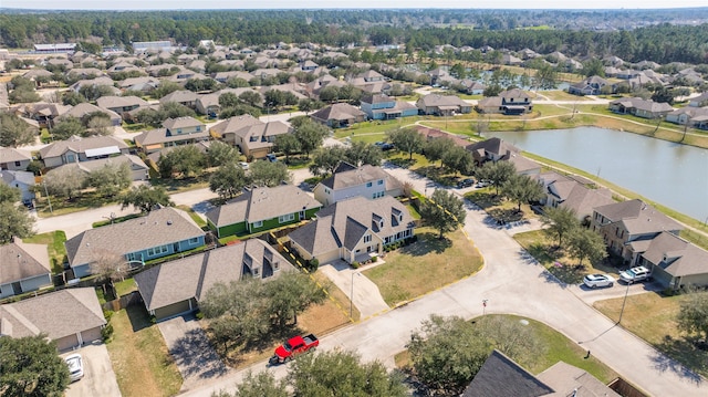 birds eye view of property with a residential view and a water view