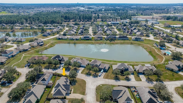 birds eye view of property featuring a water view and a residential view