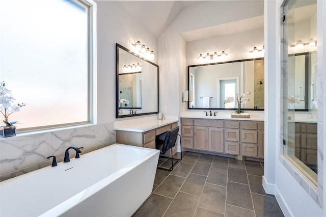 2521 Warwick Dr, Celina, TX 75009 - full bath featuring a soaking tub, tile patterned floors, and vanity