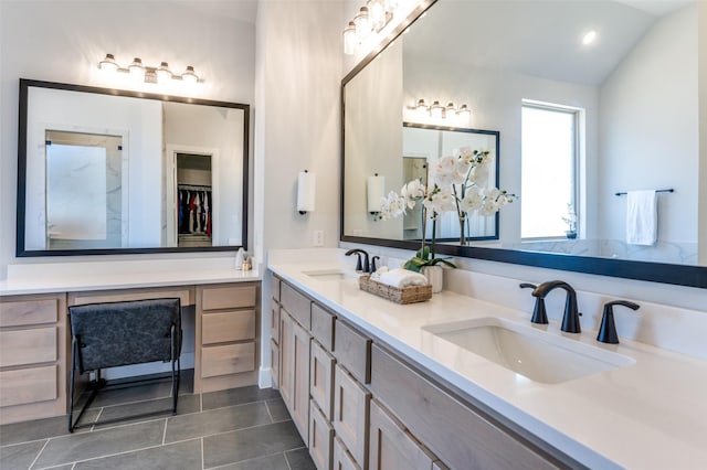 2521 Warwick Dr, Celina, TX 75009 - full bath with double vanity, lofted ceiling, tile patterned floors, and a sink