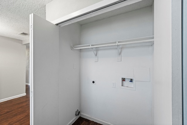 washroom with laundry area, visible vents, dark wood-style flooring, hookup for an electric dryer, and washer hookup