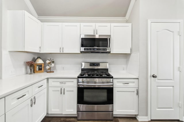 kitchen with white cabinets, stainless steel appliances, and light countertops