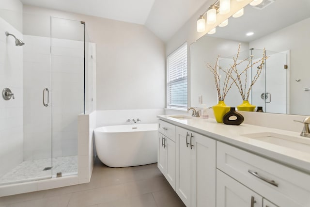 bedroom with visible vents, baseboards, dark wood-style floors, ensuite bath, and vaulted ceiling