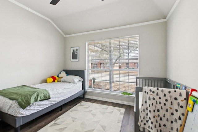 bedroom with wood finished floors and baseboards