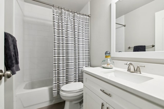 full bathroom featuring shower / bath combination with curtain, vanity, and toilet