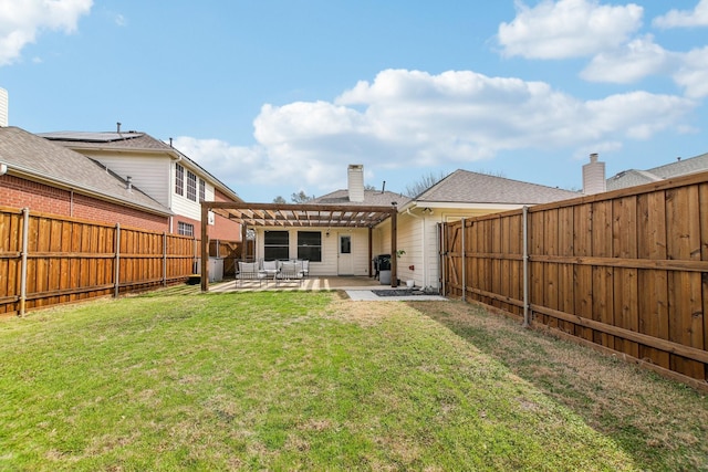 rear view of property featuring a chimney, a lawn, a patio area, a pergola, and a fenced backyard