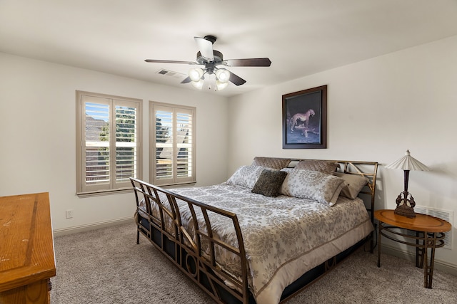 bedroom featuring carpet floors, visible vents, baseboards, and a ceiling fan