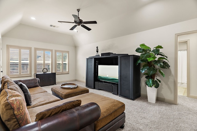 living room with light carpet, baseboards, visible vents, and vaulted ceiling