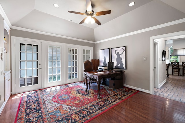 office space featuring baseboards, vaulted ceiling, wood finished floors, and ornamental molding