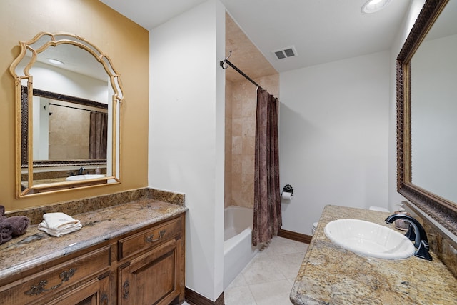 full bathroom featuring tile patterned flooring, vanity, visible vents, baseboards, and shower / bath combo with shower curtain