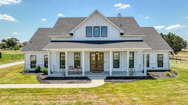 modern inspired farmhouse with roof with shingles, a porch, and board and batten siding