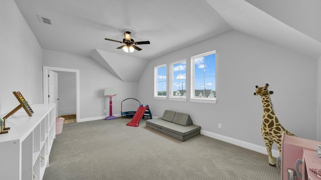 recreation room featuring lofted ceiling, carpet flooring, visible vents, and baseboards